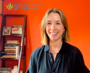 Erika Barnett in front of an orange wall